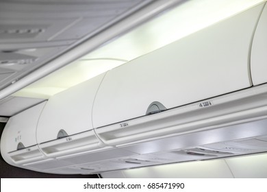 Overhead compartment - detail shot of an airplane cabin interior