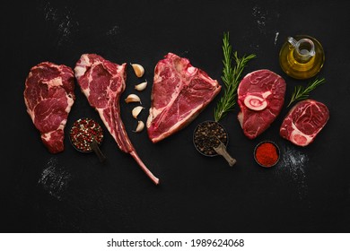 Overhead Composition With Raw Prime Beef Cuts - Porter House, Cowboy Steak, Ossobuco, Ribeye And Tri-tip Roast