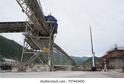 Overhead Conveyor Belt For Concrete Transport In Large Construction Site.
Yellow Warning 