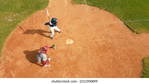 OVERHEAD CRANE Batter Baseball Player Hits A Ball Over A Home Plate