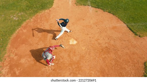 OVERHEAD CRANE Batter Baseball Player Hits A Ball Over A Home Plate