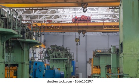 Overhead Crane Or Bridge Crane Include Hoist Lifting For Transportation, Manufacturing, And Production. Factory Warehouse Overhead Crane Lifts The Load,