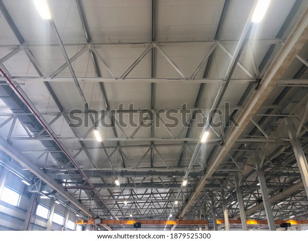 Overhead crane inside industrial building. Bridge\
crane inside hangar