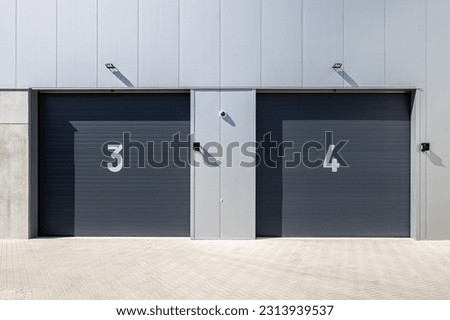 To overhead doors in a logistics centre, Numbers three and four.
