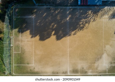 Overhead Drone Photo Of An Earthen Football Field. Aerial View, Sport Amateur.