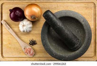 Overhead Food Shot With Mortar And Pestle On Cutting Board