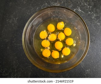 Overhead Image Of Twelve Egg Yolks In A Glass Bowl 