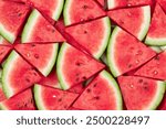 Overhead of Layers of Fresh Sliced Red Watermelon Wedges with Seeds