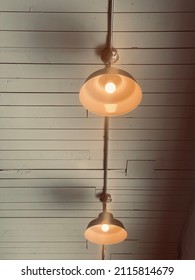 Overhead Light Fixtures On Wood Ceiling