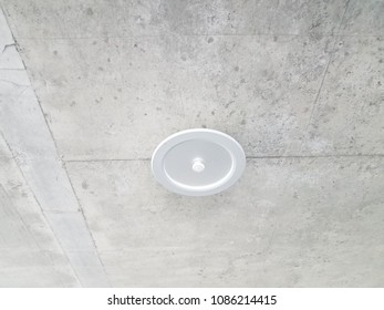 Overhead Light On A Cement Ceiling