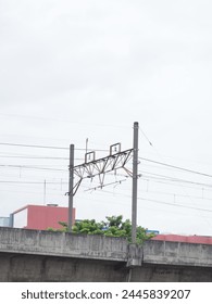 An overhead line or overhead wire is an electrical cable that is used to transmit electrical energy to electric locomotives