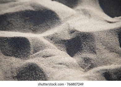 Overhead Macro Close Up On Waves Of Fine Beach Sand, Casting Shadows In The Afternoon Sun, On The California Coast