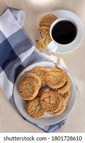 Overhead Of Peanut Butter Cookies On A Plate And Cup Of Coffee On A Table