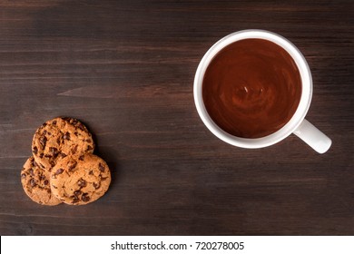 An Overhead Photo Of Chocolate Chips Cookies And A Mug Of Hot Chocolate, Shot From Above On A Dark Rustic Background With A Place For Text, A Winter Breakfast