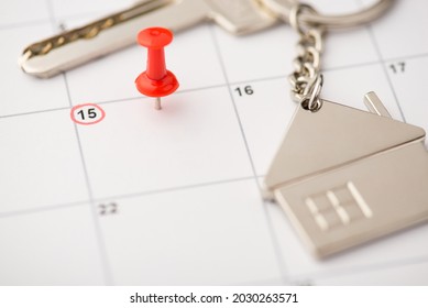 Overhead Photo Of Label Date 15 With Inscription Move House Red Pin And Key With Key Ring As House Isolated On The Calendar Background
