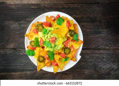 An Overhead Photo Of Nachos With Queso, Traditional Mexican Snack, On A Rustic Background With A Place For Text