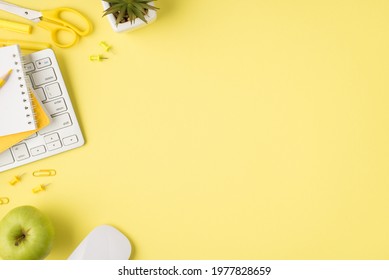 Overhead Photo Of Notepad Plant Pencil Pen Keyboard Felt-tip Paperclips Computer Mouse And Apple Isolated On The Yellow Background With Empty Space