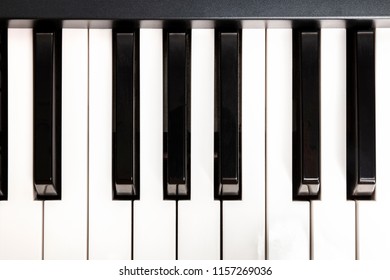 An Overhead Photo Of Piano Keys, Musical Notes