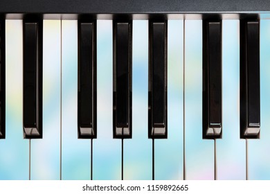 An Overhead Photo Of Piano Keys, Musical Notes, Toned