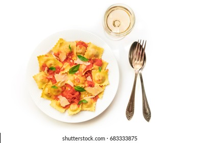 An Overhead Photo Of A Plate Of Ravioli With Tomato Sauce, Grated Parmesan Cheese, And Basil Leaves, Shot From Above On A White Background With A Glass Of Wine, A Fork And A Spoon, With Copy Space