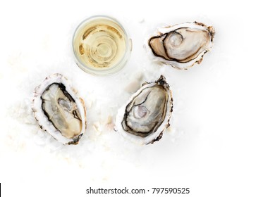 An Overhead Photo Of Three Freshly Opened Oysters On Ice, With A Glass Of Wine, And A Place For Text