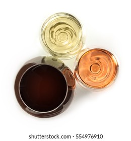 An Overhead Photo Of Three Glasses Of Wine: White, Rose, And Red, On White Background. Selective Focus