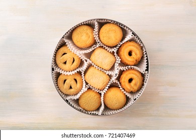 An Overhead Photo Of A Tin Can Of Danish Butter Cookies, Shot From Above On A Light Background Texture With A Place For Text