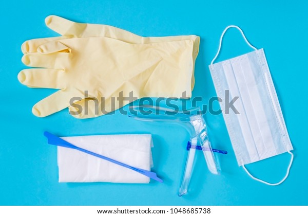 An Overhead Photo Of The Vaginal Speculum Napkin Medicine Gloves Health Mask And Spatula The 2428