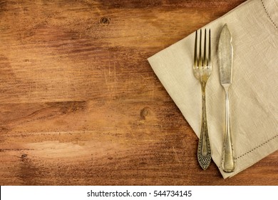 An Overhead Photo Of A Vintage Fork And Knife On A Wooden Background Texture. A Restaurant Menu Or Special Offer Banner Design Template