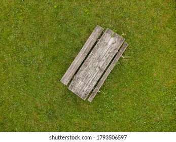 Overhead Photograph Of Rustic Picnic Table On Green Grass