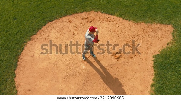 OVERHEAD Pitcher baseball player throws a ball from\
the pitcher\'s mound