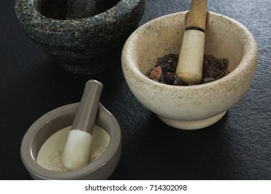 Overhead Of Sea Salt And Black Salt In Mortar Pestle