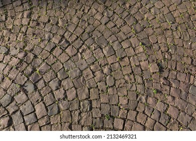 An Overhead Shot Of Arched Cobblestone Pavement