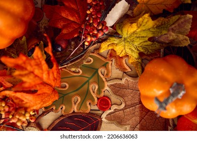 Overhead Shot Of Autumn Or Fall Table Decoration At Home With Pumpkins And Leaves