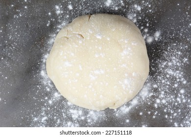 Overhead Shot Of A Ball Of Dough On A Baking Sheet Sprinkled With Flour. Horizontal Format.