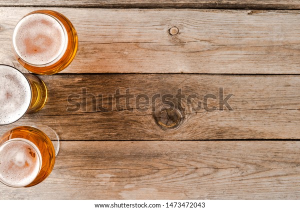 Download Overhead Shot Beer Glasses On Wooden Stock Photo Edit Now 1473472043 PSD Mockup Templates