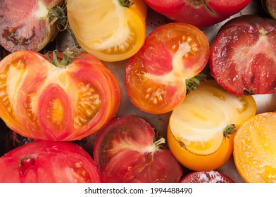 An Overhead Shot Of Big Beautiful Heirloom Tomatoes Sliced In Half