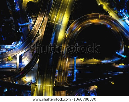 An overhead shot of a busy intersection in Bangkok, Thailand.
