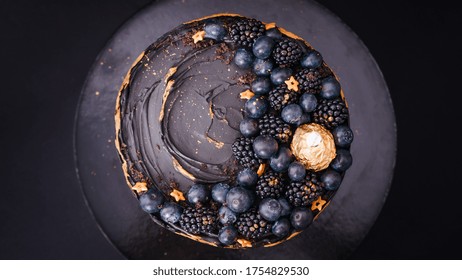 An Overhead Shot Of A Cake Decorated With Blackberries And Blueberries