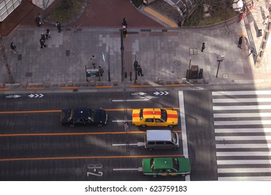 Overhead Shot Of Cars Waiting At A Crosswalk In Ginza, Tokyo. Photo Taken January 2017.