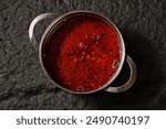 Overhead shot of Chinese Sichuan two-flavor hot pot, spicy and mushroom soup. Top view.