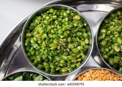 Overhead Shot Of Chopped Green Chili Peppers In Steel Bowl