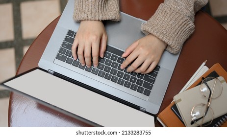 Overhead Shot, Female Freelancer Remote Working At Outdoor Cafe, Hands Woking On Laptop Computer.