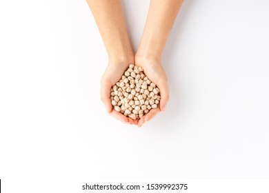 Overhead Shot Of Woman’s Hands Holding Chickpeas Beans Isolated On White Background