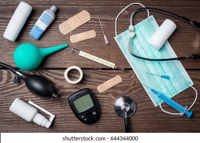 Overhead shot of medical equipment on wooden table. Close up - Shutterstock ID 644344000