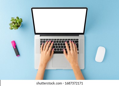 Overhead Shot Of Office Desktop With Female Hands Working On Laptop With Copyspace. Business Background With Accessories. Flat Lay