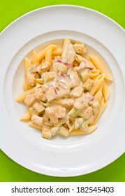 Overhead Shot Of Penne Pasta With Alfredo Sauce, Bacon And Zucchini