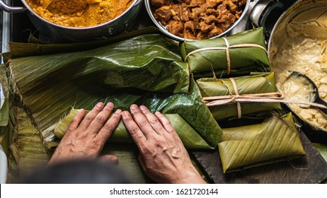 An overhead   shot of person preparing honduran tamales