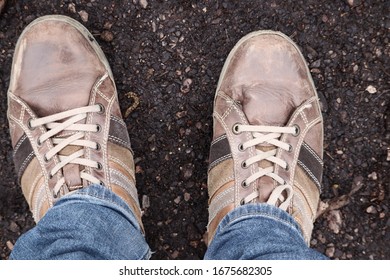 An Overhead Shot Of A Person Standing On  Wet Ground