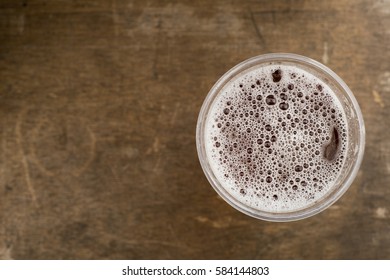 Overhead Shot Of Plastic Cup Filled With Bubbly Drink With Copy Space